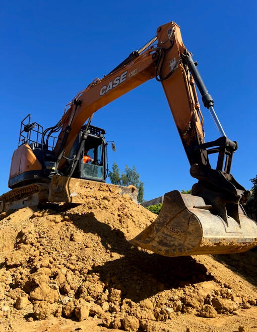 Excavator Loading Truck – All Equipped Plant Hire Excavator loading soil into a truck for earthmoving by All Equipped Plant Hire.